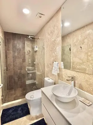 a bathroom with a sink and a toilet and a shower at Brand New Loft Few Steps From The Beach in Jacó