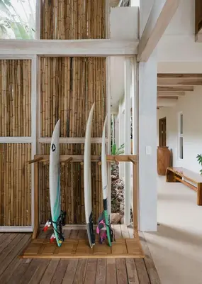 a group of surfboards on display in a room at Gorgeous beachfront villa with private pool in Santa Teresa Beach