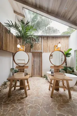 a bathroom with two benches and a bath tub at Gorgeous beachfront villa with private pool in Santa Teresa Beach
