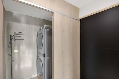 a kitchen with a refrigerator in a wall at Heavenly View - 2 BDRM Oceanview Apartment in Jacó