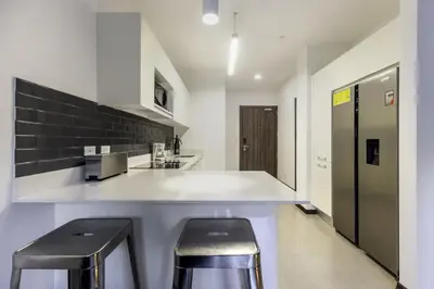 a kitchen with two stools and a counter top at Corporate Stays Urban Flats 1 Bedroom in San Rafael