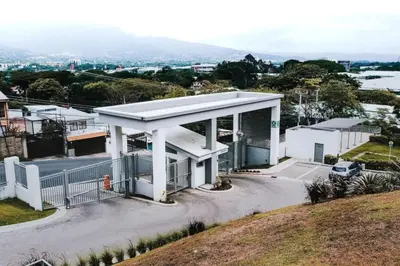 a white building on top of a hill at Corporate Stays Urban Flats 1 Bedroom in San Rafael