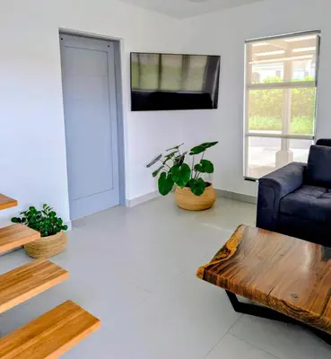 a living room with a couch and a coffee table at Casa PAMPA in Liberia