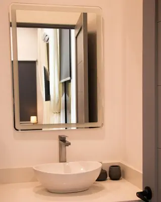 a bathroom with a white sink and a mirror at Casa PAMPA in Liberia