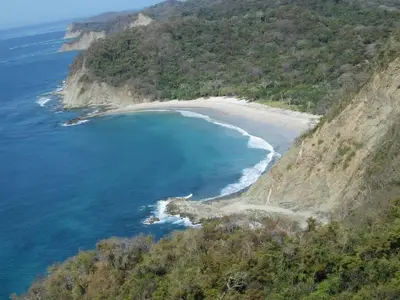 an aerial view of a beach on the side of a mountain at Poolside Unit at Beachfront Hotel Unit 6 in Sámara
