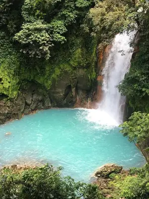 a pool of water in front of a waterfall at Samara Tree House Inn Unit 4 in Sámara