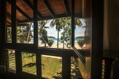 a window view of the beach from a house at Samara Tree House Inn Unit 4 in Sámara
