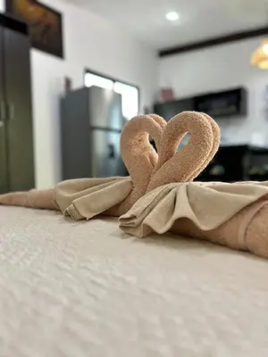 a couple of towels with hearts on a bed at Apartamento Villas Luna in Potrero