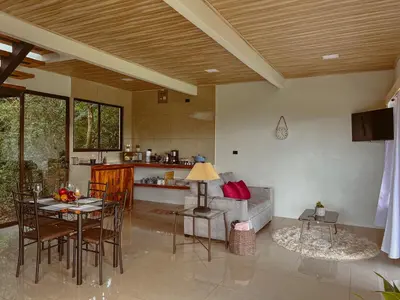 a living room with a table and a couch at Cabaña Elvira in La Cruz