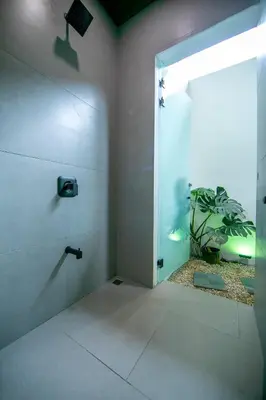 a bathroom with a shower with a plant in it at Villa Alma Verde in Fortuna