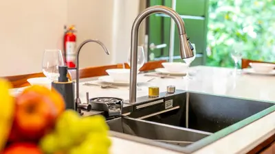 a kitchen with a sink and a counter top with a sink at Villa Alma Verde in Fortuna