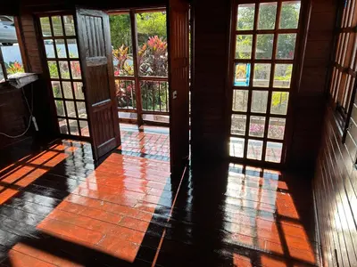 an open door to a room with glass windows at San Luis cabin in Grecia