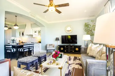 a living room with a couch and a table at Casa Serena Luxury Retreat in Reserva Conchal in Brasilito