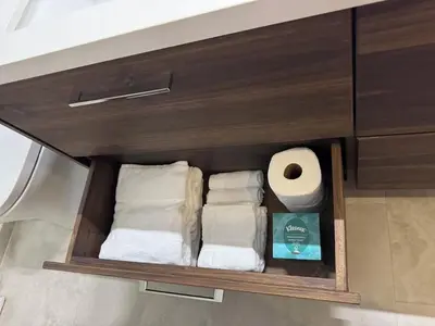 a drawer with towels and a roll of toilet paper at Luxury Ocean View Villa in Playa Hermosa