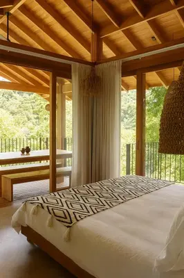 a bedroom with a bed and a large window at Santa Hermosa Honey moon Villa in Santiago