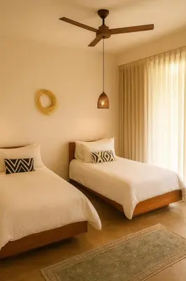 a bedroom with two beds and a ceiling fan at Santa Hermosa Honey moon Villa in Santiago
