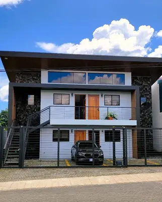 a house with a car parked in front of it at Fortuna River Way Apartments in Fortuna