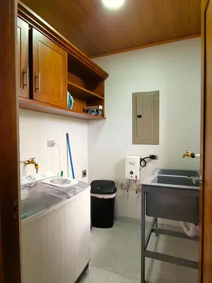 a small kitchen with a sink and a counter at Fortuna River Way Apartments in Fortuna
