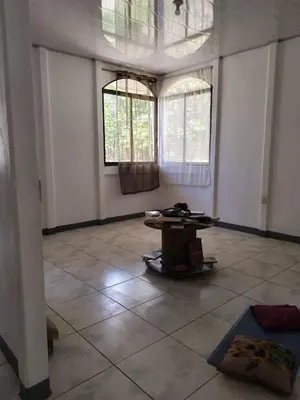 a room with two windows and a table in it at Aura Living in La Garita