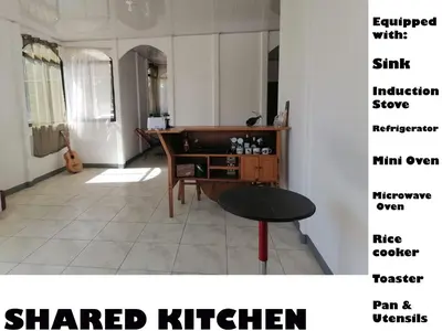 a living room with a desk and a table at Aura Living in La Garita