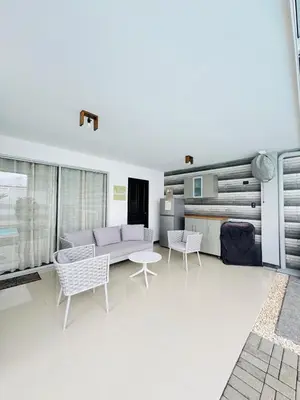 a living room with a couch and chairs and a table at Family home in Bejuco with pool and beach access in Bejuco