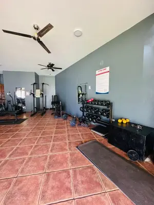 a room with a ceiling fan and a tile floor at Family home in Bejuco with pool and beach access in Bejuco