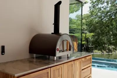 a kitchen with a toaster on a counter with a window at Casa McCash in Tamarindo
