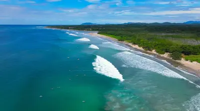 an aerial view of a beach with white waves at Avellanas Private Villa in Santa Cruz