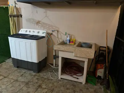 a kitchen with a stove and a sink at Tu casa de habitación en Sarapiquí, Costa Rica in Pedregal