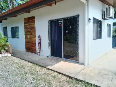 a house with a door and a porch at Fruta de mango #2 in Lagunillas