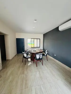an empty room with a table and chairs in it at Modern Home Near Playa Bandera Great Location in Parrita