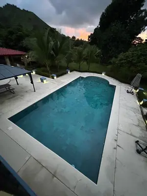 a large swimming pool in a backyard at Casa Lapa Herradura con piscina grande privada in Herradura