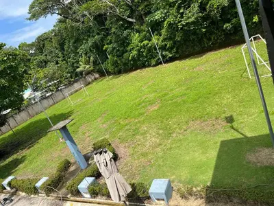 a grassy hill with a cross on top of it at Casa Lapa Herradura con piscina grande privada in Herradura