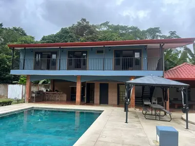 a house with a swimming pool in front of it at Casa Lapa Herradura con piscina grande privada in Herradura