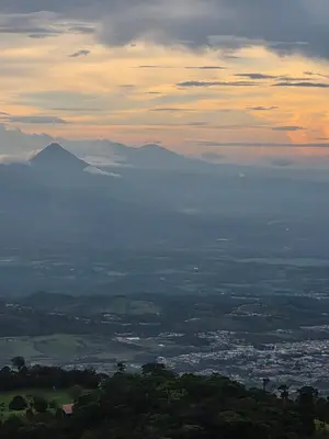 a view of a valley with mountains in the distance at San Vicente Mountain in Colón