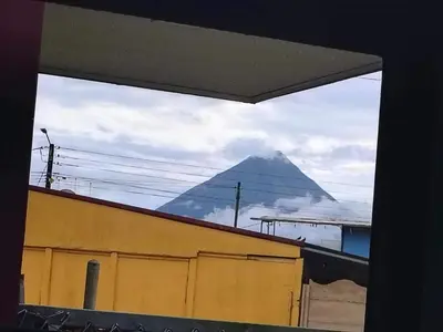 a view of a pyramid from a window of a building at La Fortuna Brisas del Recuerdo in Fortuna