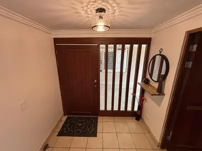 a hallway with a door with a gate and a light at Stunning Ocean View Villa in Playa Coco and Ocotal in Ocotal