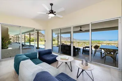 a living room with a couch and a table at Luxury villa Potrero in Potrero