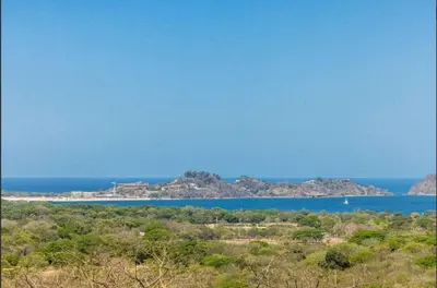 an island in the middle of a body of water at Luxury villa Potrero in Potrero