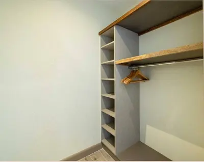 a walk in closet with a wooden shelf in it at Luxury villa Potrero in Potrero