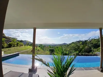 a view of a swimming pool from a house at Luxury villa Potrero in Potrero