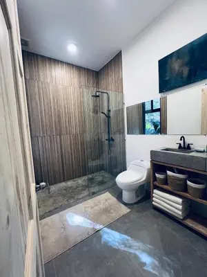 a bathroom with a shower and a toilet and a sink at Peaceful house in nature 5 min drive from beach in San Juanillo