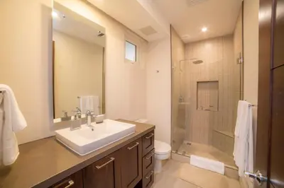 a bathroom with a sink and a shower at Miramar 5D -3 bedr 3 bath Ocean View in Herradura