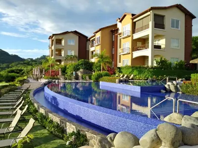 an image of a swimming pool at a resort at Miramar 5D -3 bedr 3 bath Ocean View in Herradura