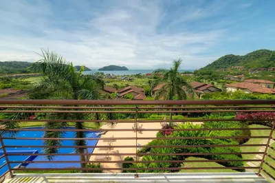 a view of the ocean from a balcony at Miramar 3B - 3 bedr 3 bath Ocean View in Herradura
