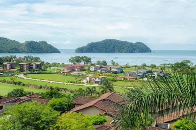 a village with houses and the ocean in the background at Miramar 3B - 3 bedr 3 bath Ocean View in Herradura