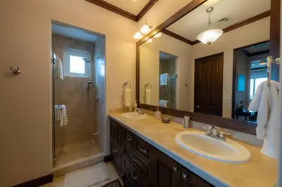 a bathroom with two sinks and a shower at Altavista 4C 3 bdr 3 bath Ocean View in La Mona