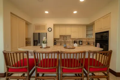 a kitchen with a large island with chairs around it at Bella Vista 1C - 3 bdr - 3 1 and half bath in La Mona