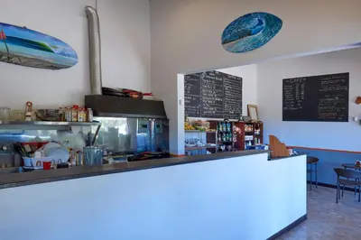 a counter in a restaurant with a counter top at Playa Negra Surf Lodge in Playa Negra