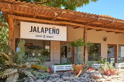 a jalapro sign on the front of a store at Playa Negra Surf Lodge in Playa Negra